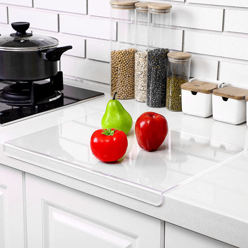 Durable, hygienic acrylic cutting board, featuring a non-slip base for secure and clean food preparation.