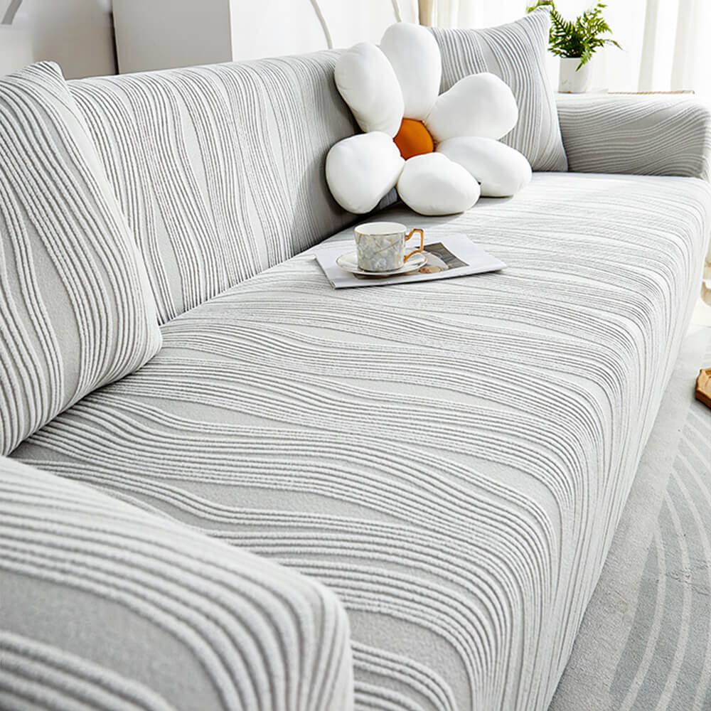 Anti-scratch sofa protector, a durable & pet-friendly stretch couch cover. Guards furniture from daily wear.