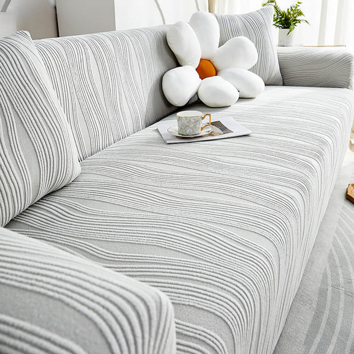 Anti-scratch sofa protector, a durable & pet-friendly stretch couch cover. Guards furniture from daily wear.