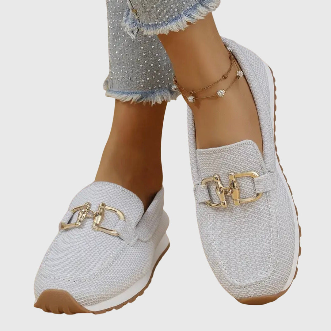 Close-up of women's dusty blue horsebit loafers, showcasing the classic design and comfortable fit.