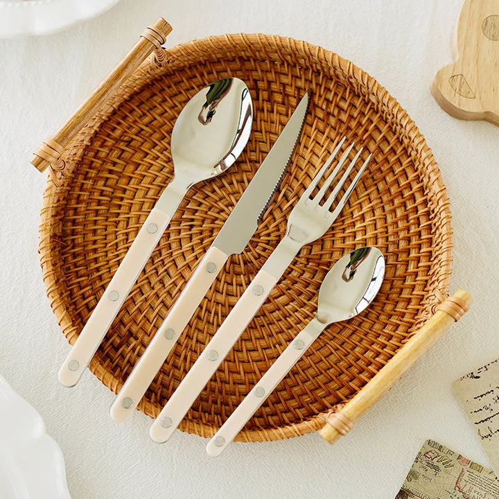 Stylish 24-piece engraved stainless steel tableware set, perfect for modern home decor & dining.