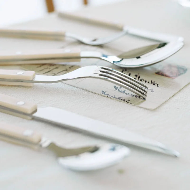 Close-up of engraved handle on a piece from the 24-piece stainless steel flatware dining set.