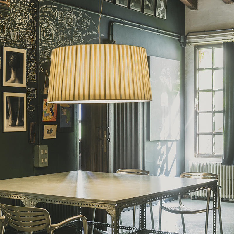 Elegant 3-light silk drum pendant in brass finish, perfect decorative lighting for dining or living rooms.