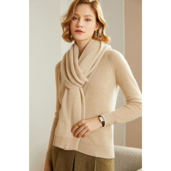 Woman's hand touching the soft knit shawl wrap, emphasizing its luxurious feel.
