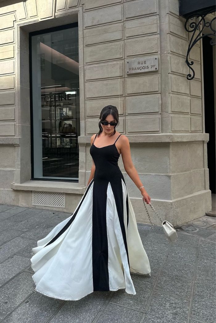 Black and white contrast maxi dress, elegant and formal, ideal for wedding guests.