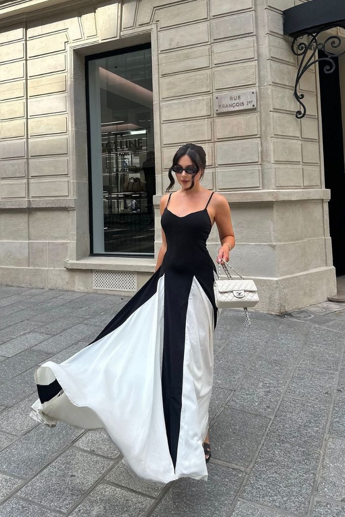 Elegant sweetheart neckline maxi dress for wedding guests, striking black and white contrast.