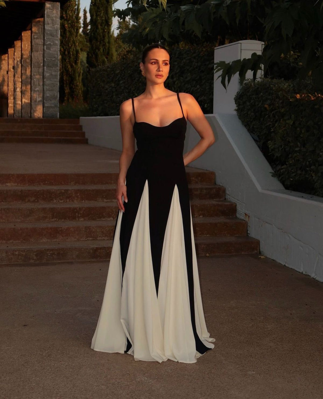 Beautiful black and white formal gown with elegant contrast design for wedding guests.