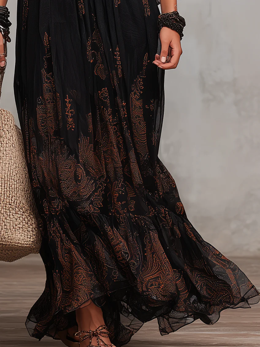 Flowy black maxi dress for women, boho style, with a comfortable V-neck, elegant flutter sleeves, and tiered design.