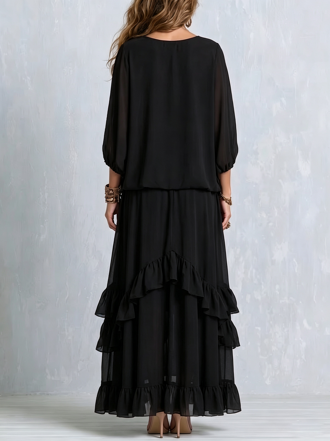 Women's black flowy boho maxi skirt set, a stylish two-piece with tiered ruffles & elegant V-neck top.