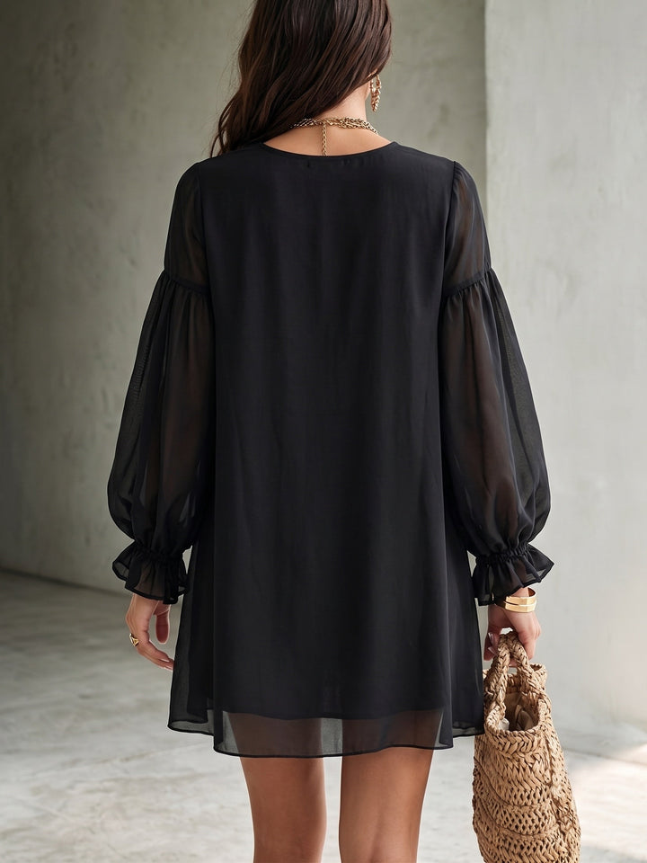 Chic women's black mini dress, featuring a V-neck, elegant balloon sleeves, and ruffled hem. Ideal for cocktail parties.