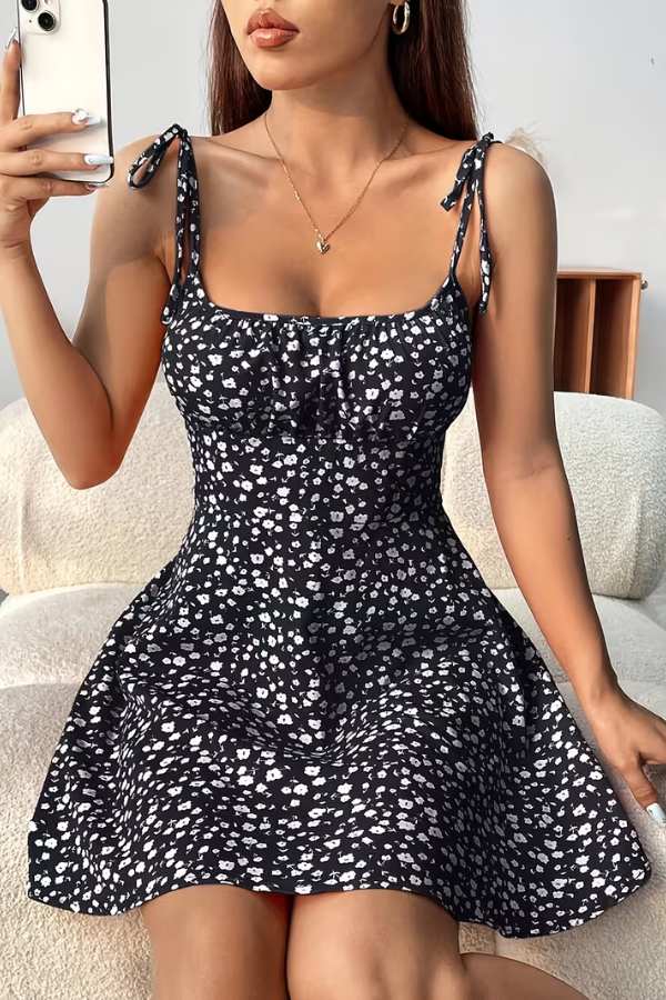 Elegant black floral strapless slip dress for women. Perfect for summer events, date nights, or a chic brunch outfit.