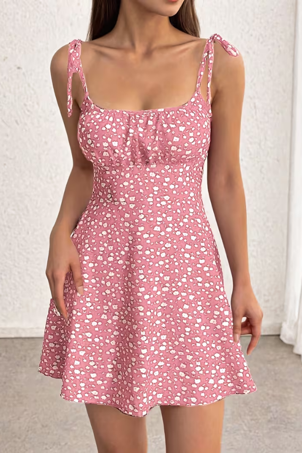 Vibrant yellow floral strapless slip dress for women. Versatile summer fashion, perfect for elegant day or evening wear.