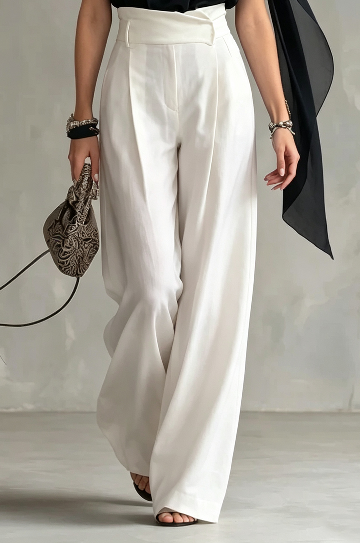 Sophisticated women's black sleeveless halter top, elegant cowl neck and dramatic flowy cape. Perfect dressy evening wear.