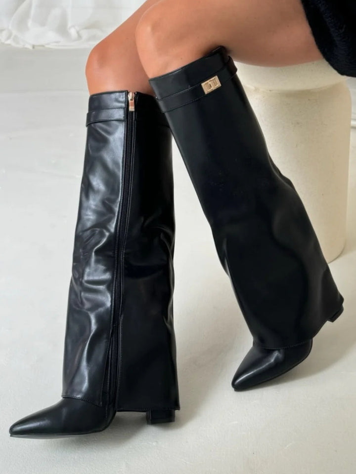 Women's black leather thigh-high boots with metallic buckle hardware, a must-have fashion item.