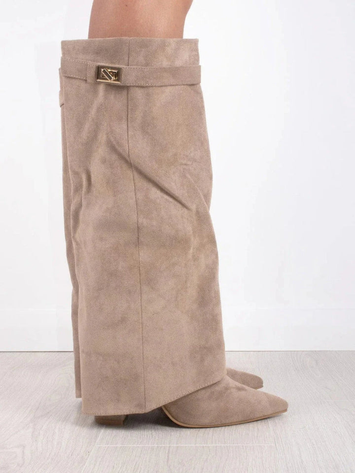 Fashionable women's tall leather boots with buckle accents, offering a sophisticated silhouette.