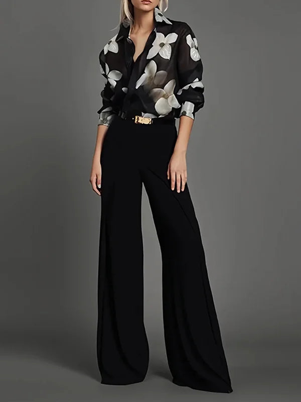 Sophisticated black long-sleeve blouse for women, an elegant top for professional or chic casual fashion. Workwear ready.