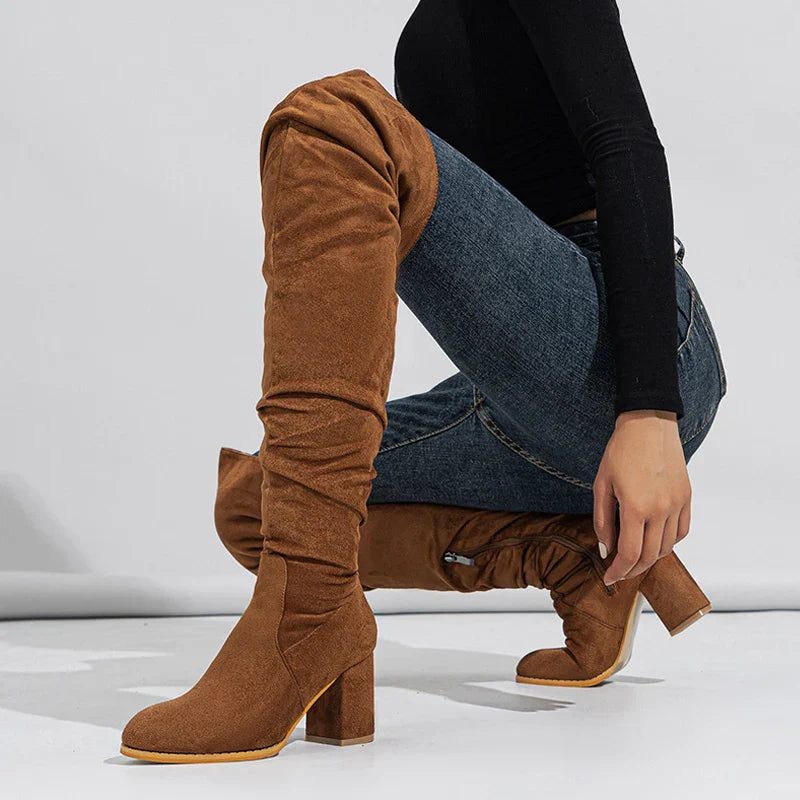 Close-up of the heel and shaft of women's over-the-knee boots, showcasing quality design.