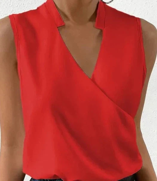 Elegant black sleeveless women's top, flattering fit, highlighting shoulders, ideal for casual or formal occasions.