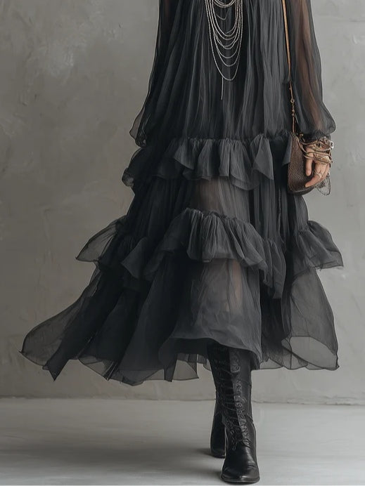 Effortless women's black tiered ruffle maxi dress. Versatile V-neck design for elegant summer wear or special events.