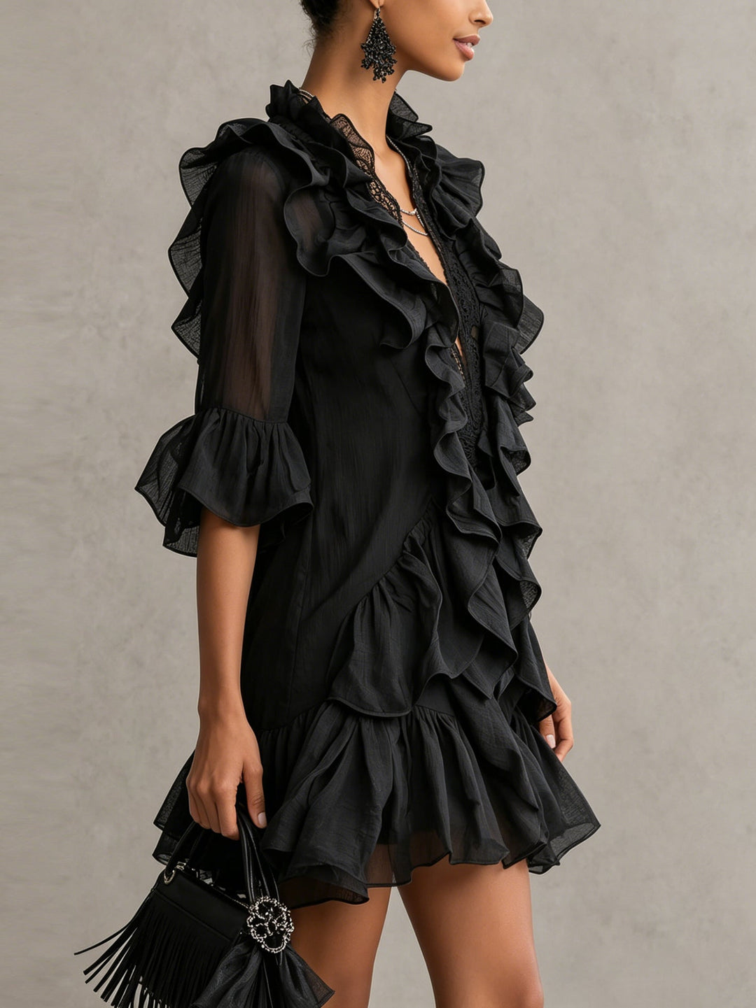 Women's black tiered ruffle mini dress with sheer sleeves, ideal for cocktail parties, date nights, or special occasions.