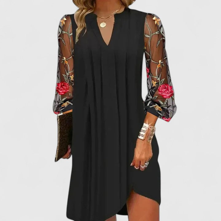 Elegant black V-neck mini dress for women, perfect for parties & cocktails. Chic long sleeve sophisticated style.