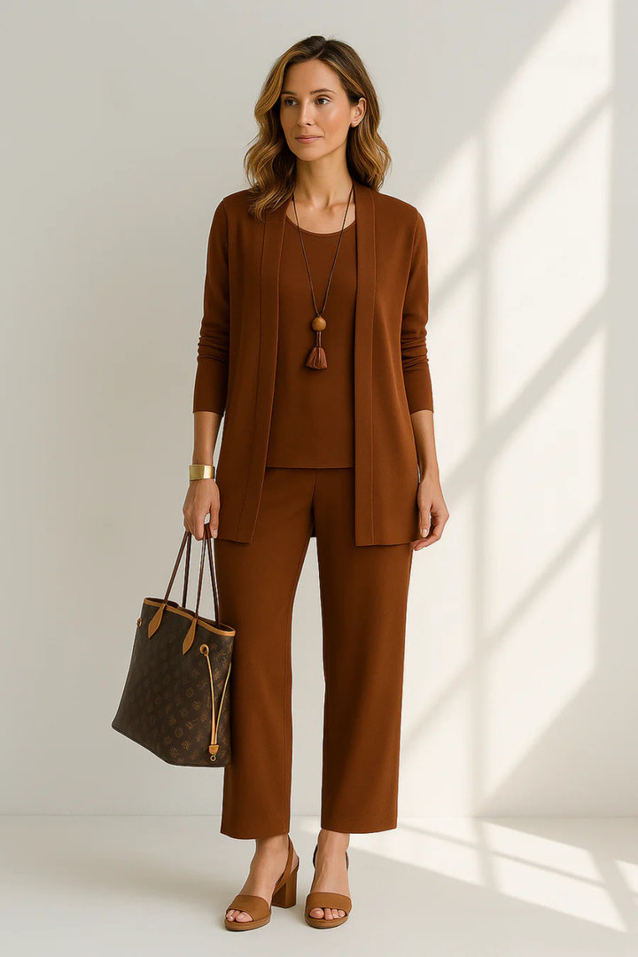 A woman looking elegant in a 3-piece outfit set, perfect for a wedding guest or special event.