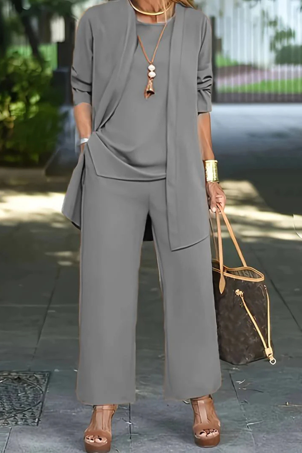 Full view of a sleek women's formal 3-piece set, a timeless addition to elegant attire.