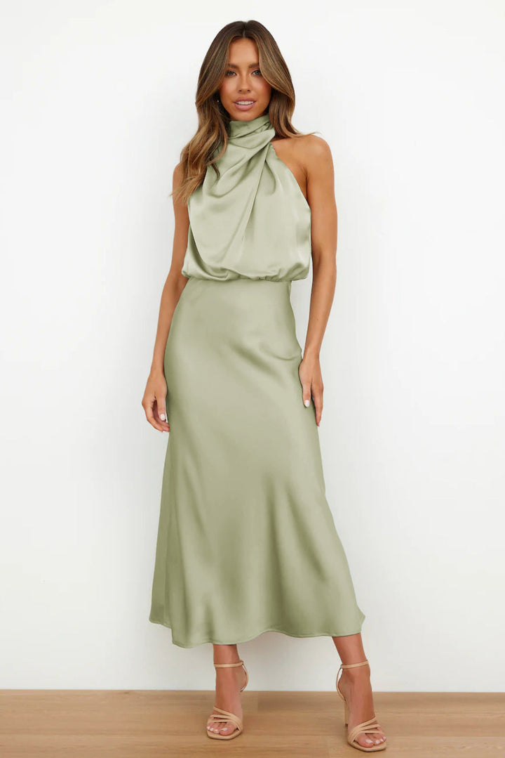 Elegant black women's halter evening dress with open back, floor-length. Perfect for galas & formal events.