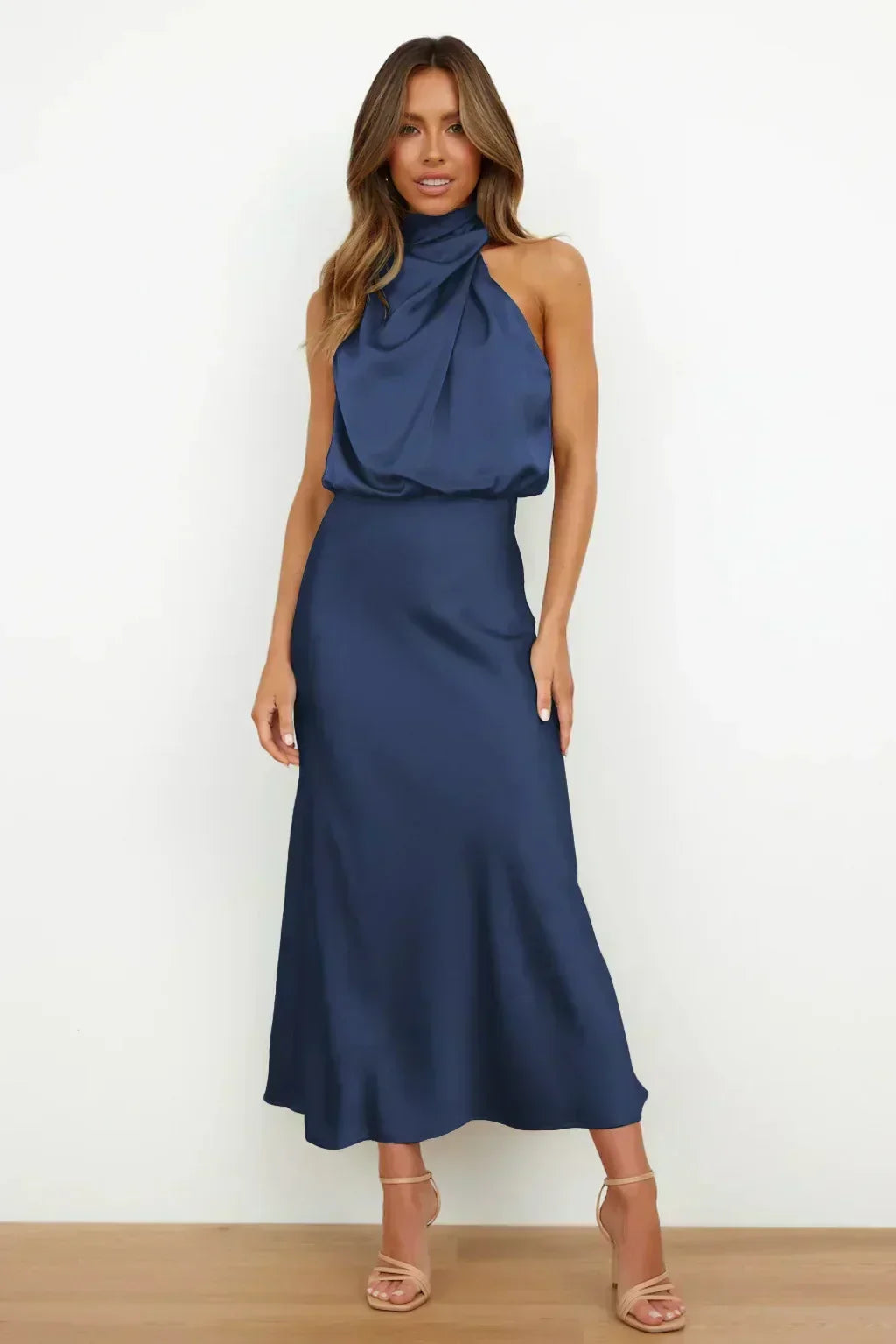 Glamorous women's formal halter gown, showcasing an elegant open back, ideal for red carpet events.