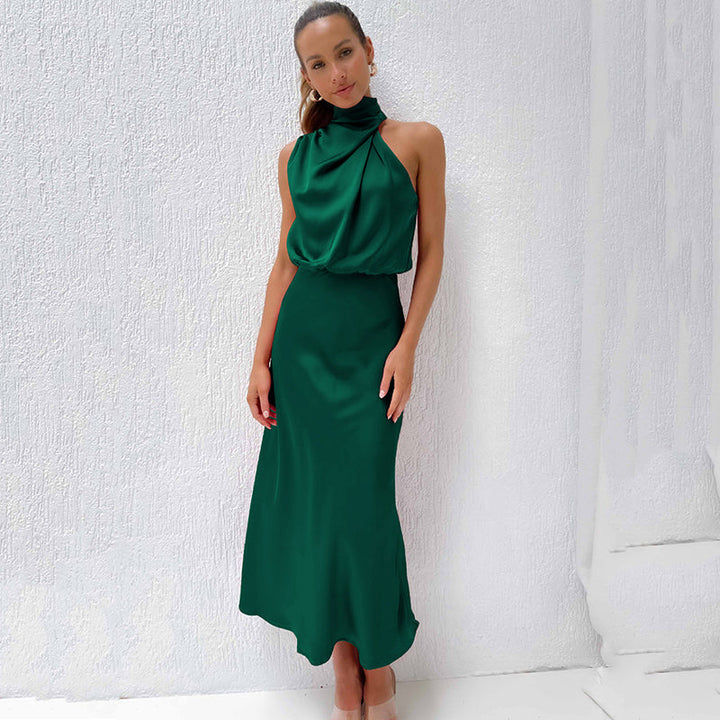 Elegant women's black halter formal dress, open back, floor-length, perfect for a wedding guest.