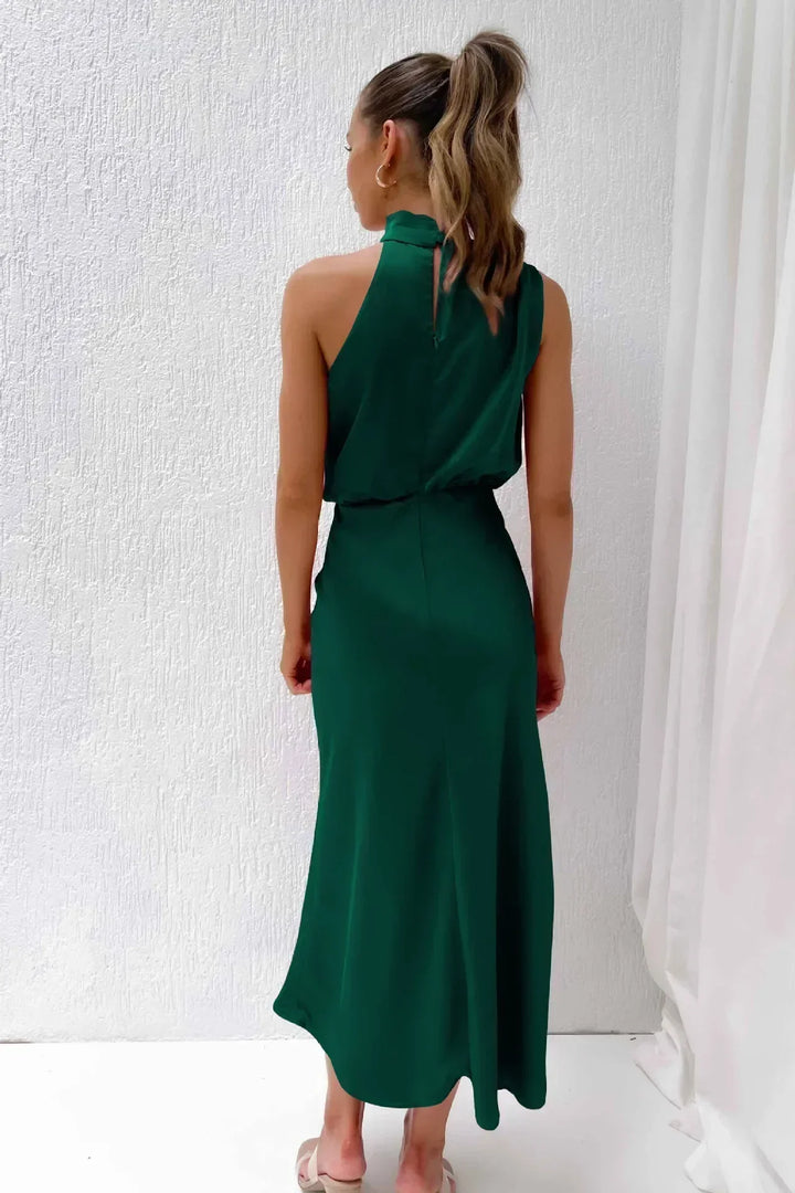 Women's stunning halter evening dress in a royal blue, featuring a chic open back design.