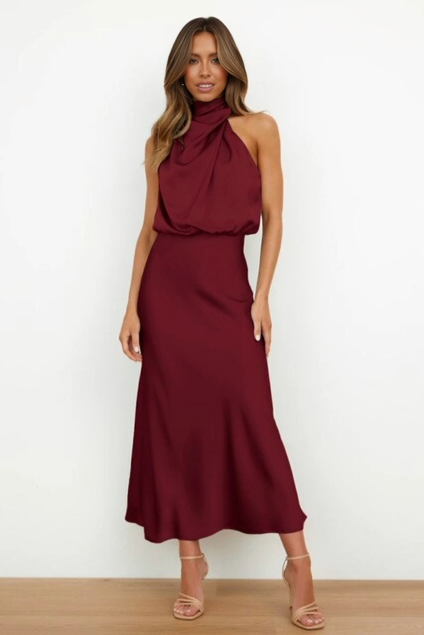 Women's elegant black open-back halter gown, sophisticated silhouette for evening events.