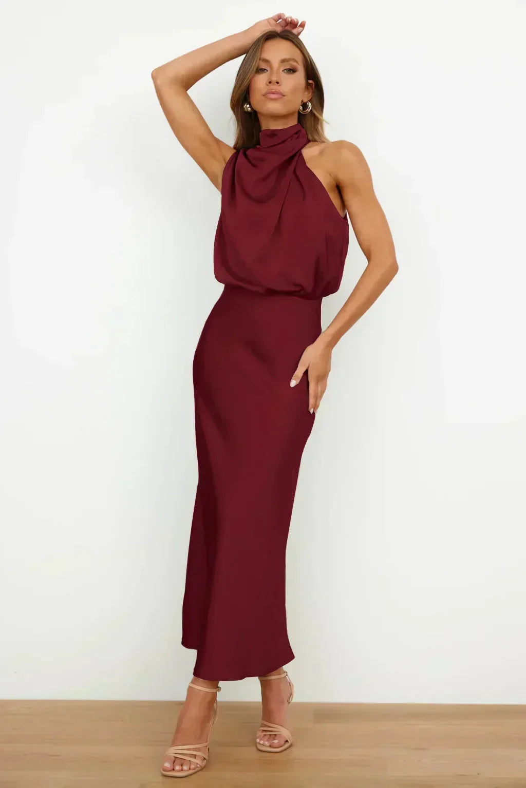 Chic women's navy halter prom gown, open back, floor-length, for a memorable special occasion.