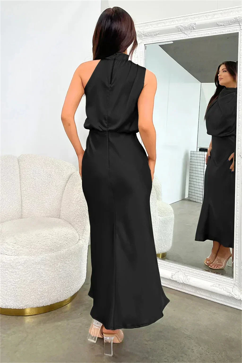 Sophisticated women's halter neck wedding guest dress, open back, floor-length & elegant.