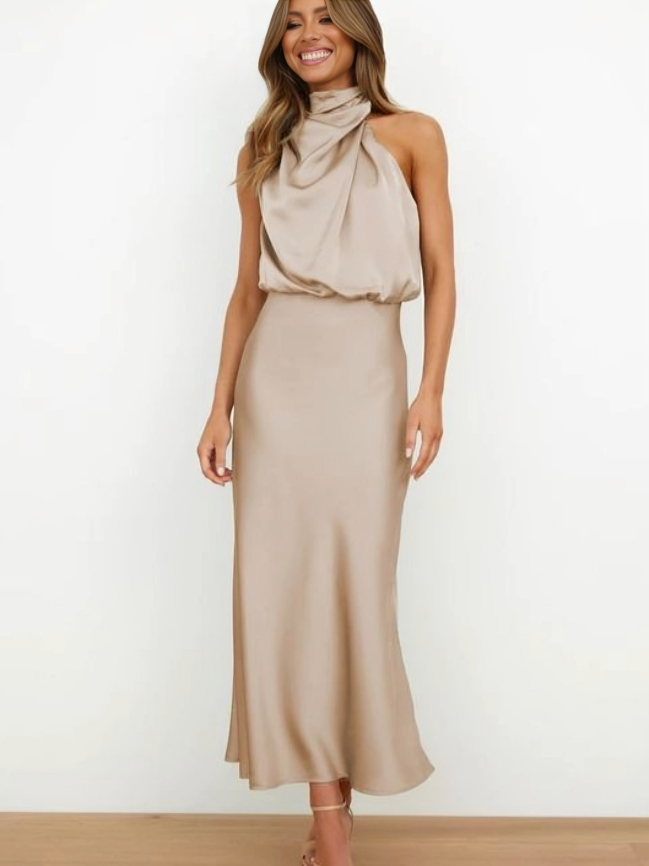 Women's formal halter neck gown in a deep red, with an alluring open back, perfect for evening wear.