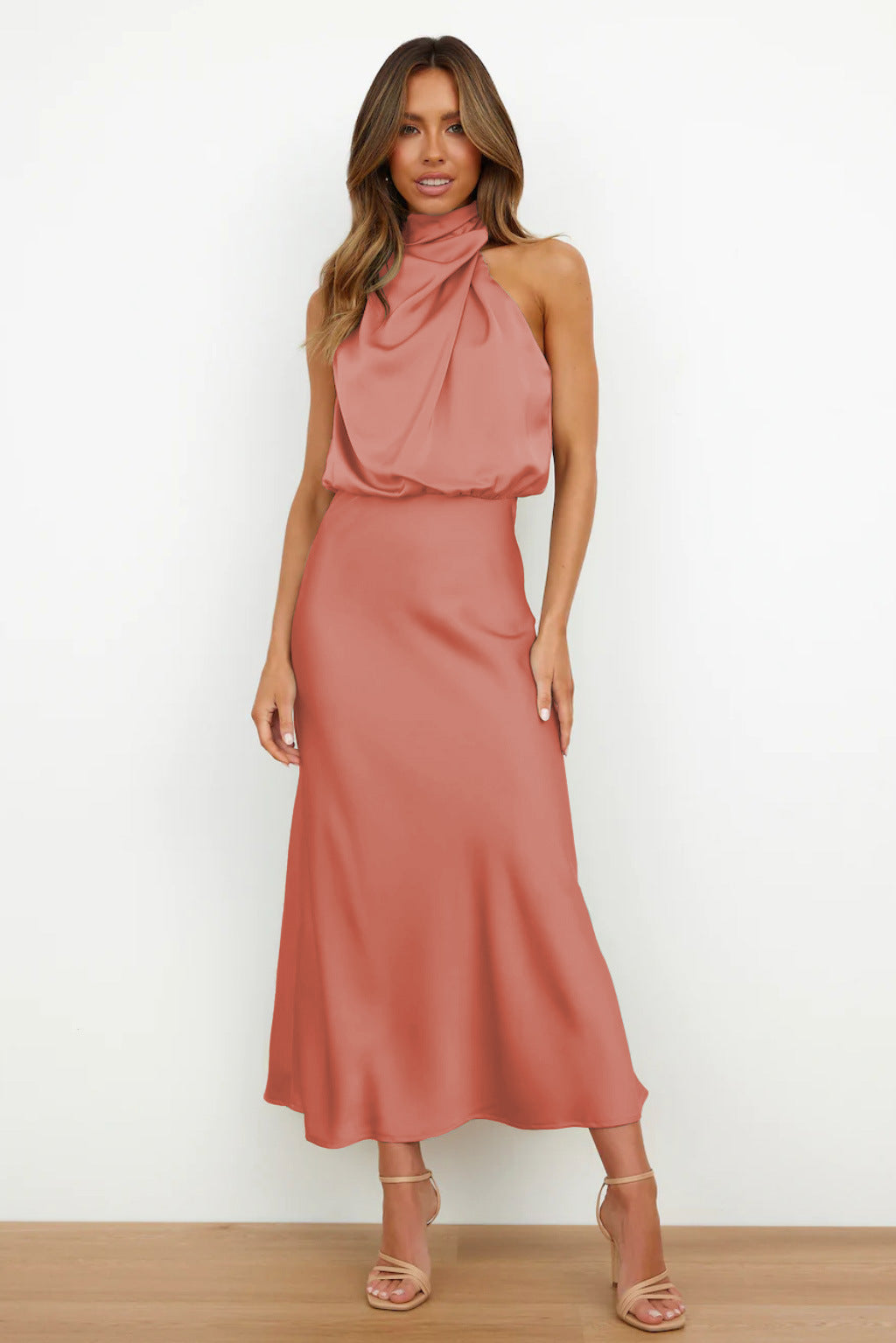 Chic women's halter prom dress, floor-length, with an elegant open back, suitable for formal events.