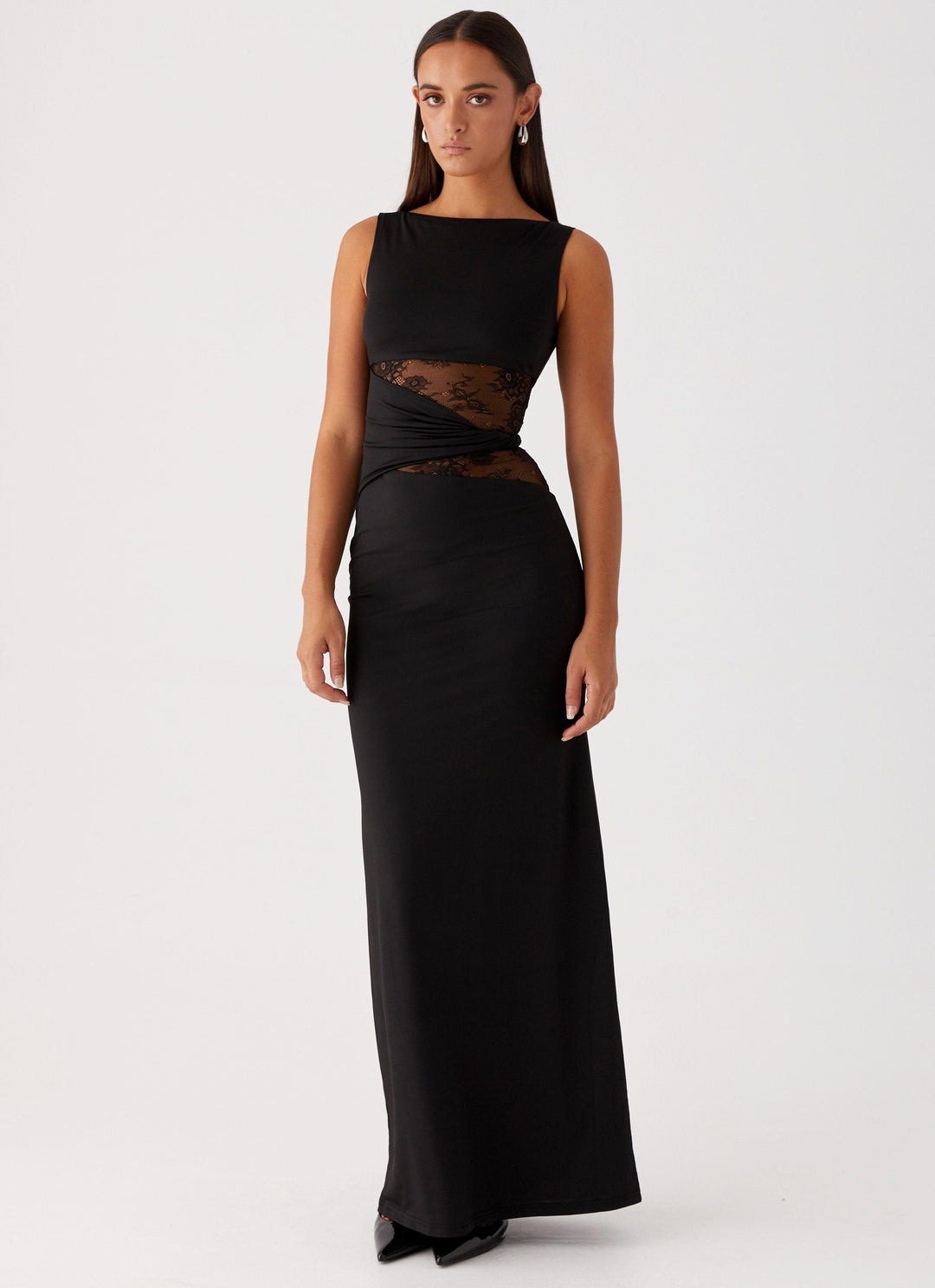 Elegant black women's maxi dress with lace cut-out, boat neck, & sleeveless design, perfect for formal evening wear.
