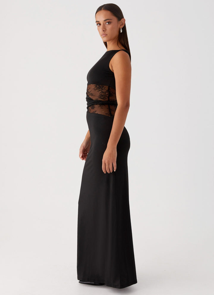 Sleeveless white maxi dress for women, featuring a boat neck and intricate lace cut-out detail, ideal for evening.