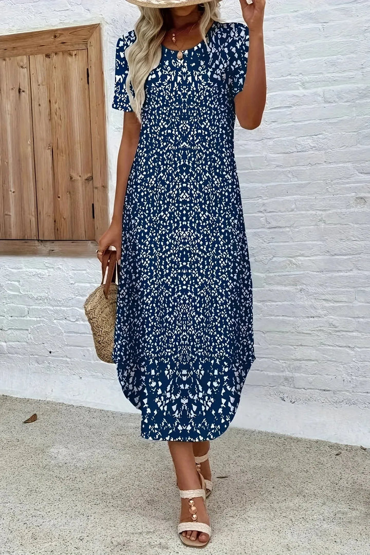 Blue elegant floral print maxi dress with a comfortable fit, suitable for summer and special occasions.