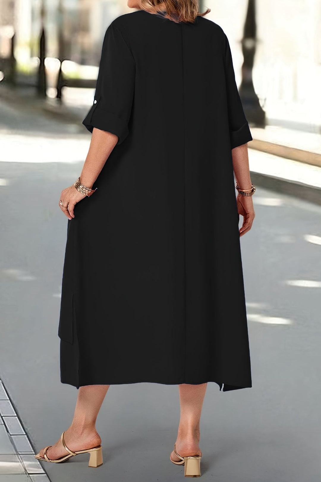 Close-up of luxurious fabric on a women's elegant maxi dress, showcasing comfortable, flowing design and quality.