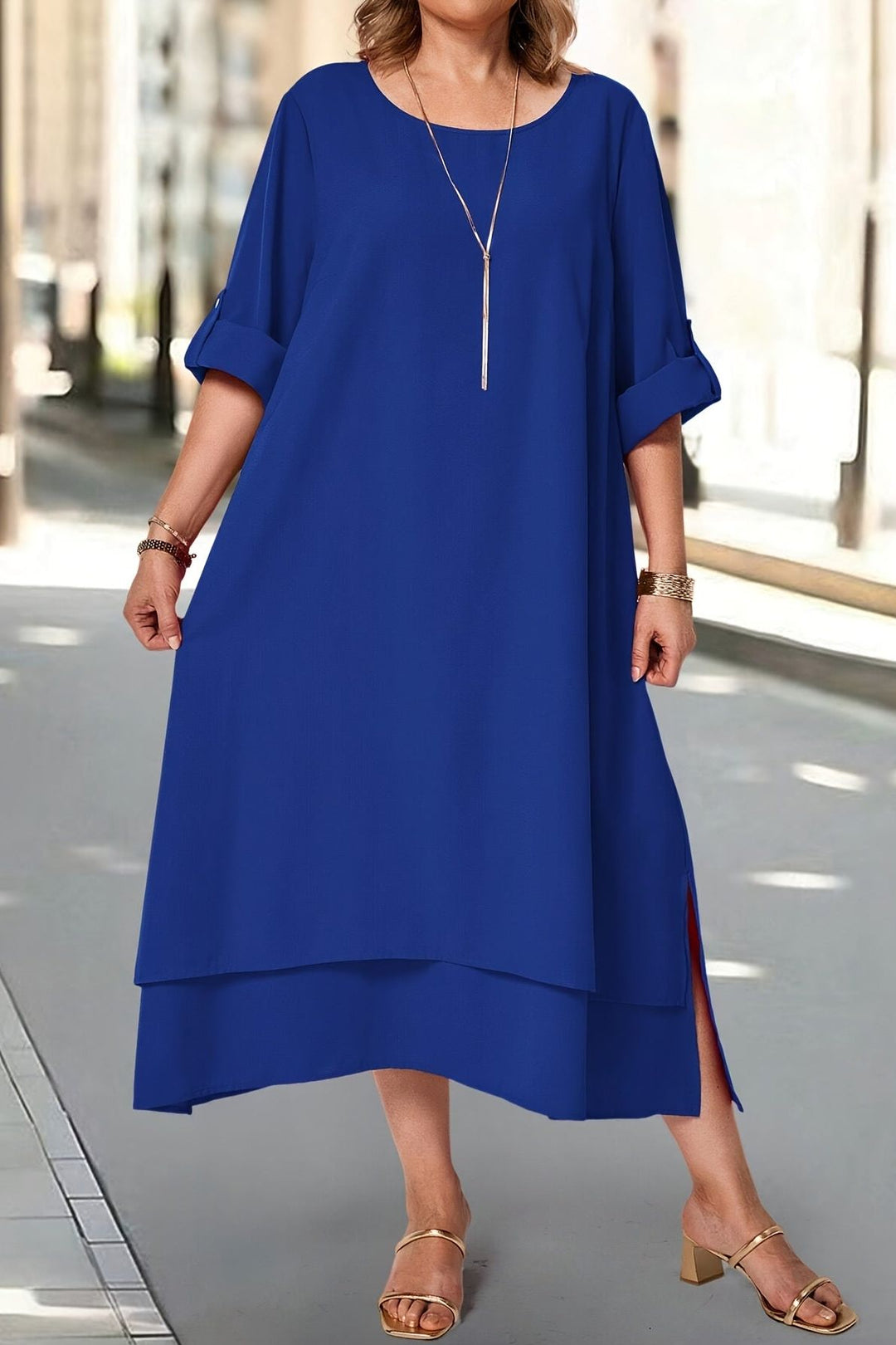 Model showcasing a sophisticated women's blue maxi dress, elegant flowing design for a graceful, fashionable look.