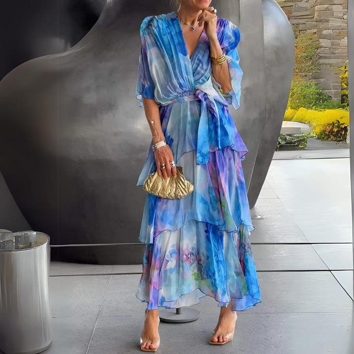 Elegant blue V-neck cocktail dress for women, featuring a flattering draped design, perfect for parties and semi-formal events.