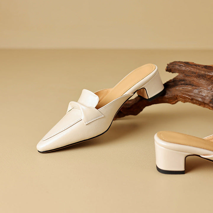 Sophisticated black leather bow mules, women's slip-on shoes for an elegant look