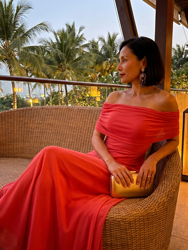 Luxurious off-shoulder midi dress with a beautifully draped bodice; an elegant choice for special occasions.