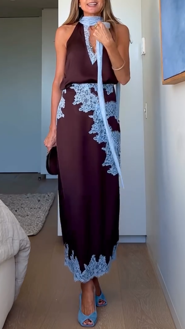 Women's flowing boho tie-dye maxi dress with a halter neckline and sexy side slit, ideal for beach or casual wear.