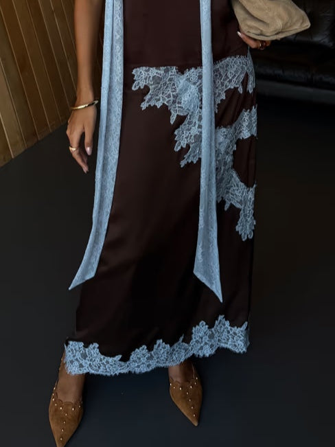 Women's elegant tie-dye maxi dress in brown. Halter style with a fashionable side slit. Perfect for summer events.