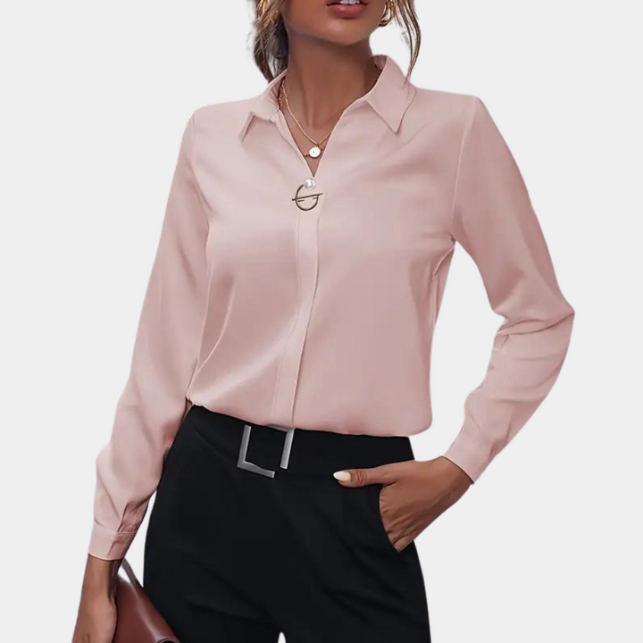 Fashionable women's long sleeve flowy chiffon blouse. Elegant spring/summer top for a sophisticated look.