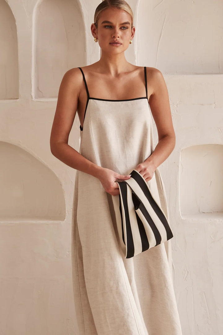 Cream summer maxi dress with a sophisticated square neck and elegant contrast trim detailing.