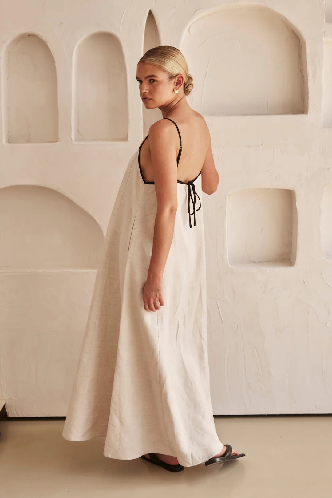 Stylish square neck cream maxi dress for women, an elegant A-line silhouette with eye-catching trim.