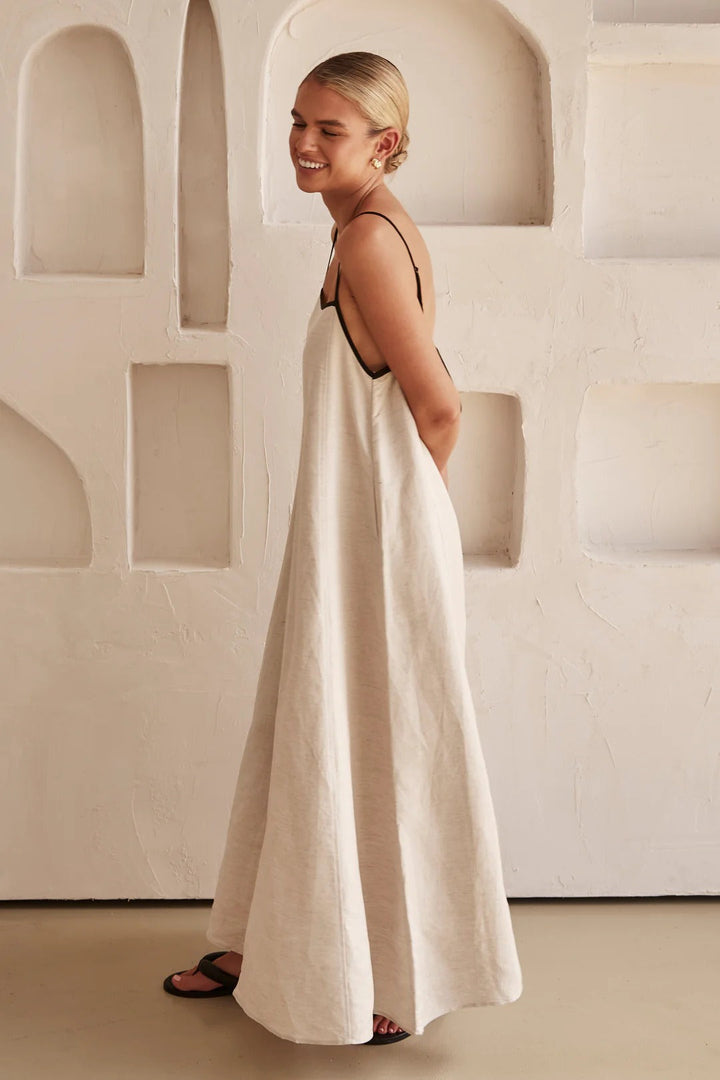 Women's cream spaghetti strap maxi dress, summer-ready with a square neck and elegant contrast trim.